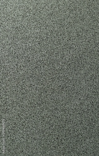 Terrazzo cement background with black and white stone grains scattered all over concrete floor
