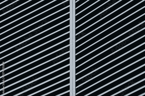 Black Metal Louvered Facade with Diagonal Lines and Geometric Pattern