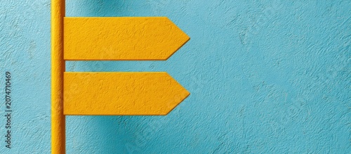 Two blank yellow directional arrows point right against textured blue wall
