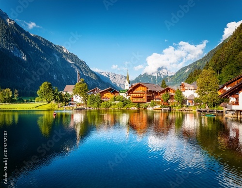picturesque village nestled by the lake in the austrian alps