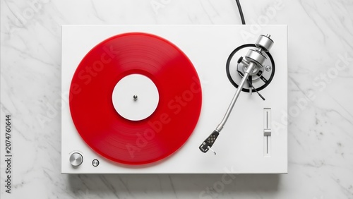 Music - Red Vinyl Record Spinning on White Turntable Overhead View on Marble Surface
