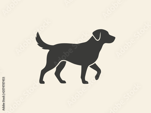 Silhouette of a walking black dog on a light beige background, simple vector illustration