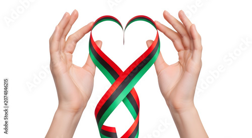 Hands forming heart shape with colorful ribbons