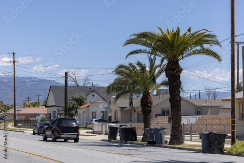 Palm trees frame a neighborhood near downtown San Jacinto, California, USA.