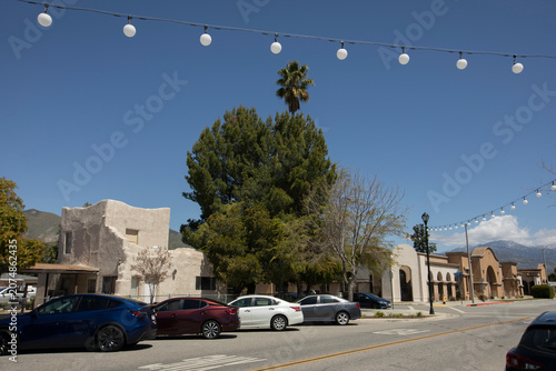 A string of lights frames buildings in historic downtown San Jacinto, California, USA.