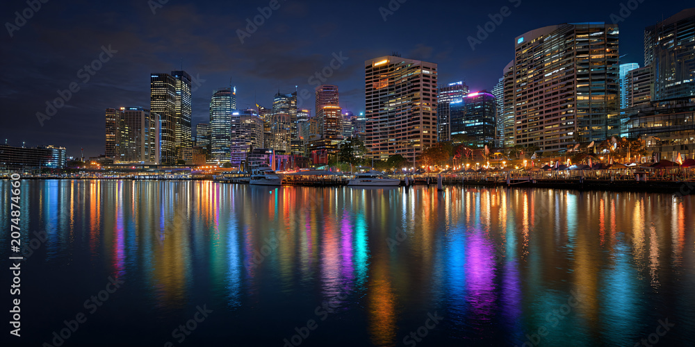 Fototapeta premium City Bay Skyline with Boats Reflecting at Night