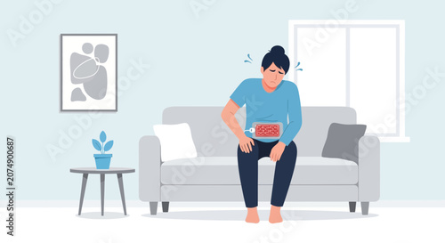 Woman Experiencing Abdominal Discomfort and Pain Relief Technology at Home