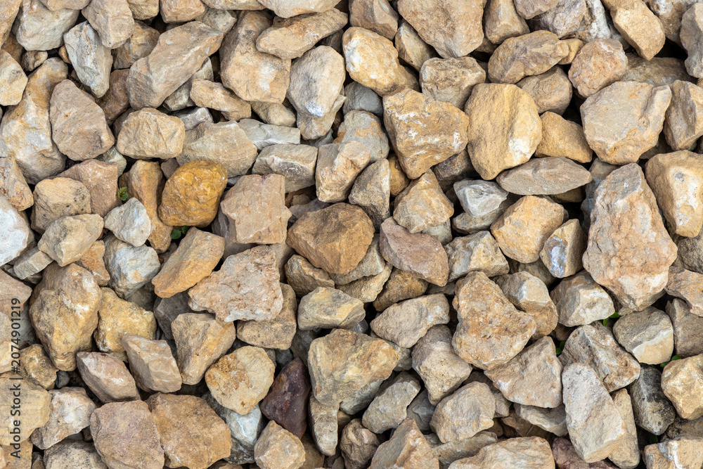 Naklejka premium Close up top view texture background of a crushed limestone rocks surface 
