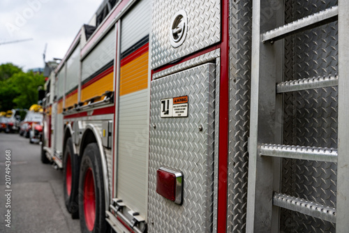 Close up of ladder fire truck side exterior.