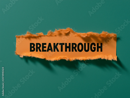 Breakthrough word on torn orange paper strip over teal background concept