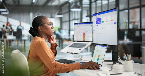 Obraz na plátně Young Business Analyst Reviews Quarterly OKR Dashboard