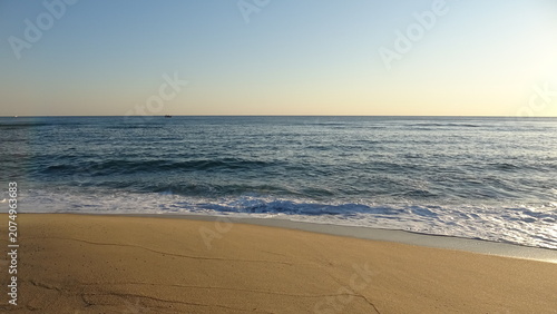 Photos Clear Sky Sunrise over Peaceful Ocean and Sandy Beach