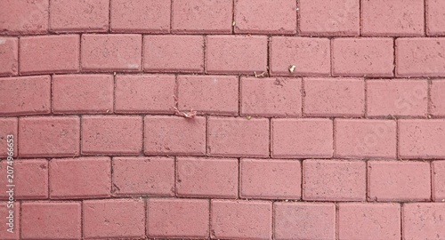 Red Interlocking Brick Pavement Texture Background with Rectangular Pattern