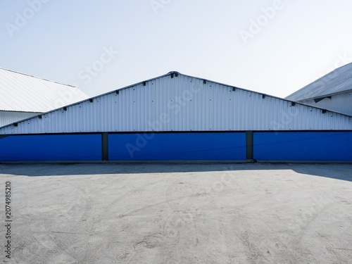 A striking minimalist architectural background showcasing geometric symmetry and clean industrial lines.