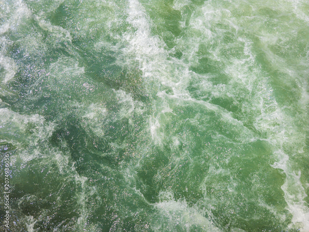 Fototapeta premium Turbulent Green Water Surface with White Foam