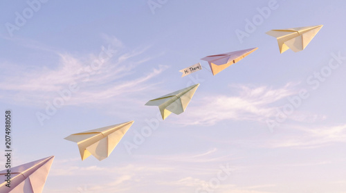 Minimalist paper planes flying in blue sky, conceptual paper airplanes soaring through clouds, leadership and business direction concept