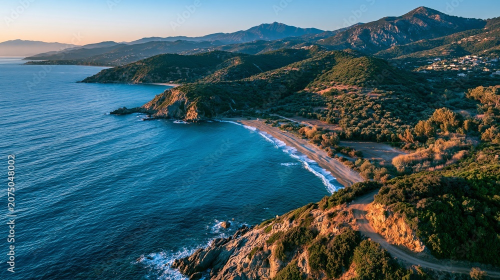 Fototapeta premium Greece's Karavostasi Beach, seen from above, shows blue water, sandy shore, and green hills at sunset.