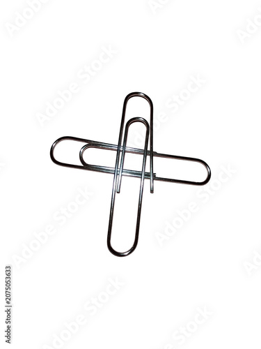 Two metal paper clips crossed together