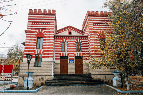 19th century Jewish Synagogue exterior. East europe, architectural monument facade, red color. Moldova, Cimislia