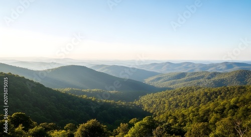 Scenic view of lush green mountains under a clear blue sky, perfect for nature and landscape photography