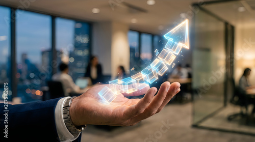 Hand holding glowing cityscape in office