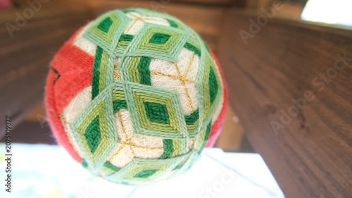 Japanese Temari Ball Swaying and Slowly Rotating on Thread