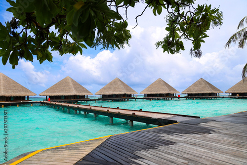 Overwater bungalows and wooden walkways in the Maldives