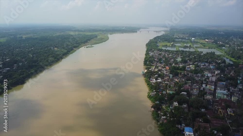 A drone flight over the Ganges River towards the bridge in Navadvip