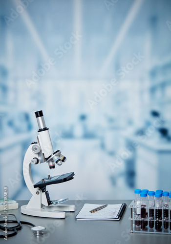 Laboratory microscope with blood test samples in modern medical research lab