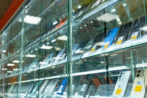A Display of Modern Smartphones in a Retail Setting Showcasing Various Models, Colors, and Features Under Bright Lighting for Potential Buyers