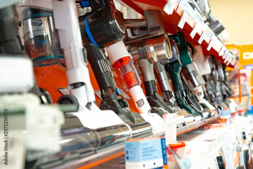 A Colorful Display of Modern Vacuum Cleaners in a Retail Store Showcasing Various Designs and Features for Every Cleaning Need