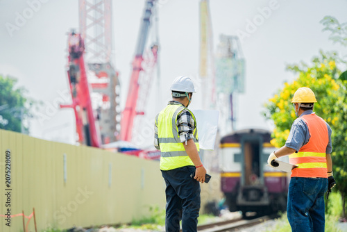 Принти на полотні Civil engineers inspecting construction site