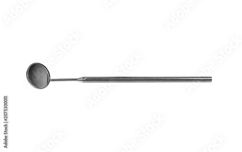 Dental mirror on black background. Medical tool for oral examination.