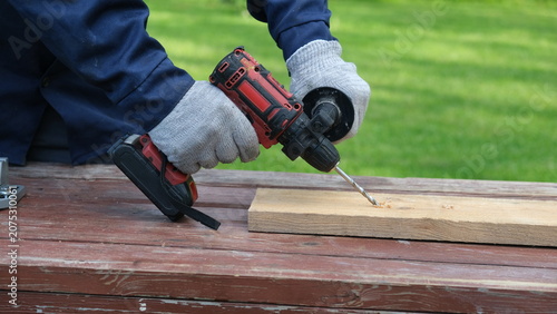 Obraz na płótnie Builder worker using cordless hammer drill