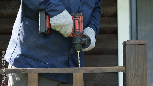 Bilde på lerret Builder worker using cordless hammer drill