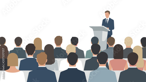 Audience members sitting in rows listening to a speaker at a podium during a corporate seminar or business conference presentation in a bright room.