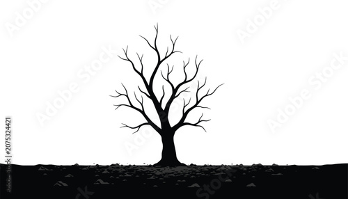 Lonely dead tree with bare branches standing on barren and rocky black ground symbolizing environmental decay and climate change impacts.