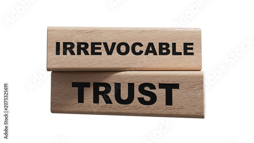Fotografie Text IRREVOCABLE TRUST writing in wood cubes