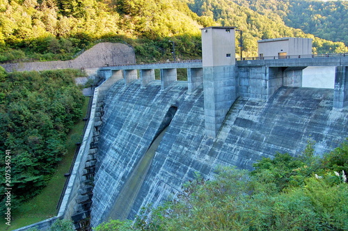 Massive concrete wall of Kawauchi Dam a gravity concrete structure in Mutsu Aomori Japan