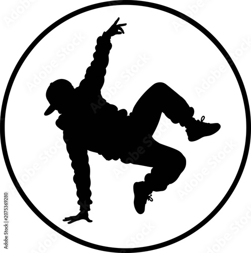 A dancer performs a dynamic breakdancing move in a circle on the floor indoors.