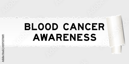 Obraz na płótnie Ripped gray paper background that have word blood cancer awareness under torn pa