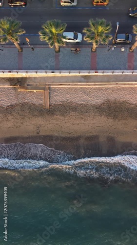 Aerial photography in 4K format – aerial view (ultra-high resolution) of sunset or sunrise on the seashore. Reflection in the water. Beautiful summer seascape of the Mediterranean Sea. Background 