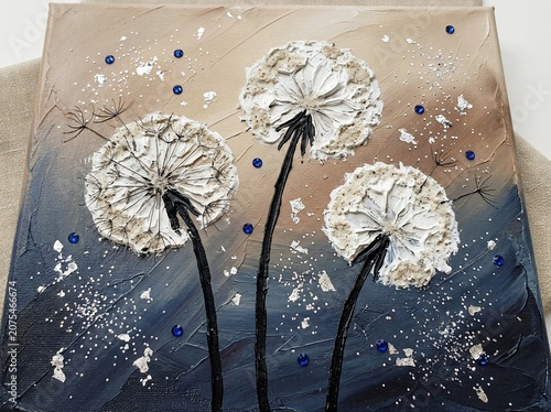 Three white dandelion flowers on dark blue background with blue beads