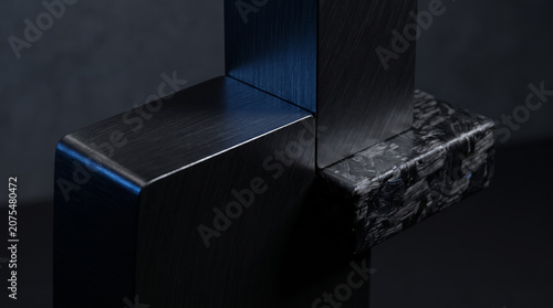 Abstract geometric composition of dark brushed metal and carbon fiber blocks background