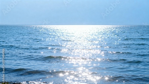 Sunlit ocean waves with sparkling reflections