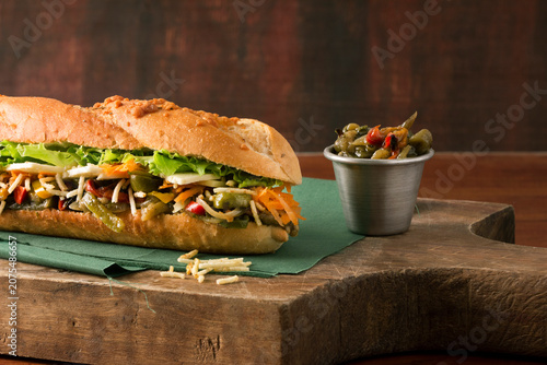 Canvastavla Artisanal sub sandwich on rustic wooden block