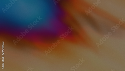 Abstract blurred background featuring soft blending colors of deep blue orange and warm brown tones