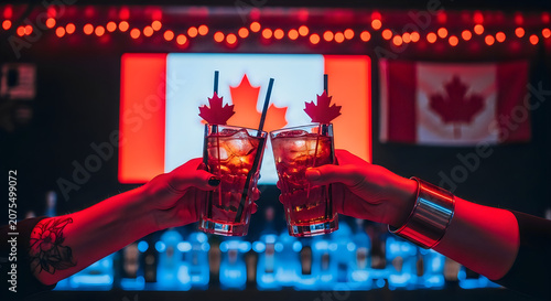 Cheers with Whiskey Glasses in Warm Bar Setting with Canadian Flags and Festive Lights