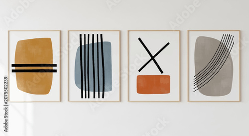 Modern Abstract Geometric Art Prints Set with Shapes and Lines in Wooden Frames on a Light Grey Wall.
