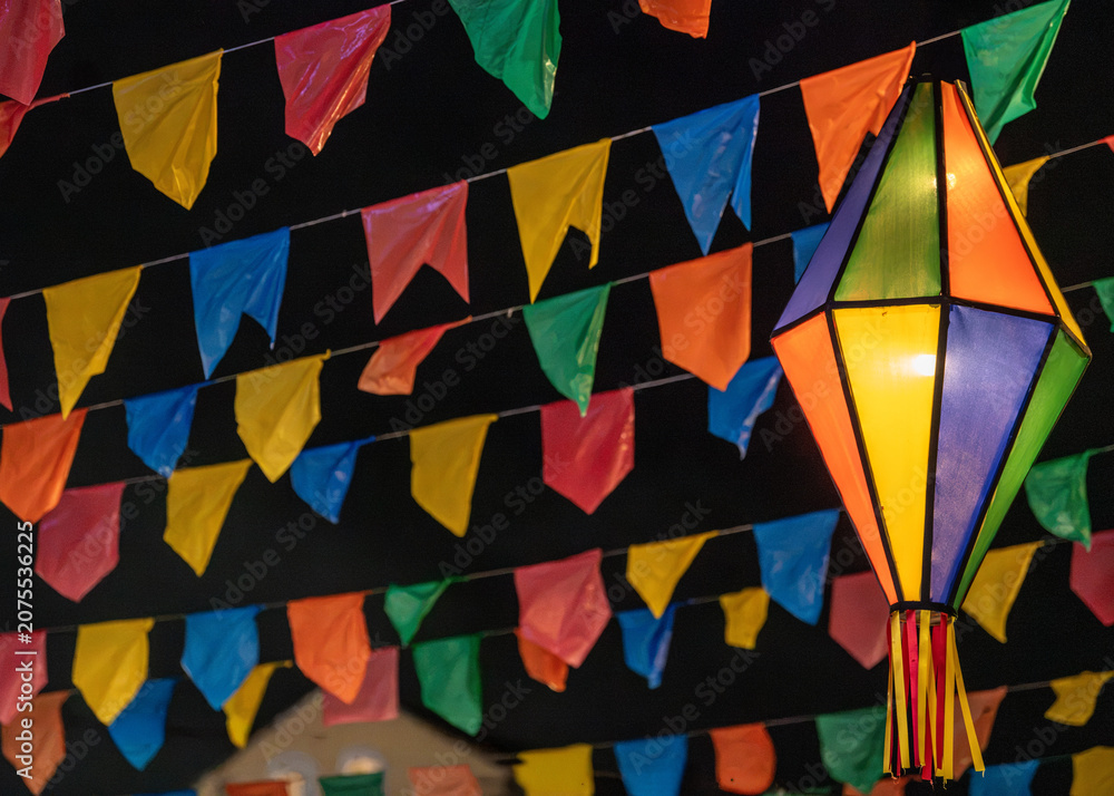 Fototapeta premium Traditional Brazilian Festa Junina Decoration with Colorful Paper Lanterns and Bunting Flags
